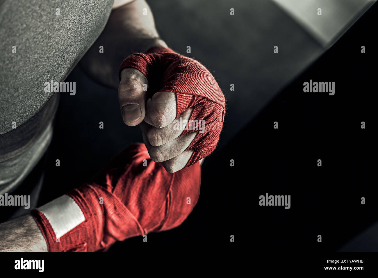 Closeup hand of boxer with red bandages Stock Photo