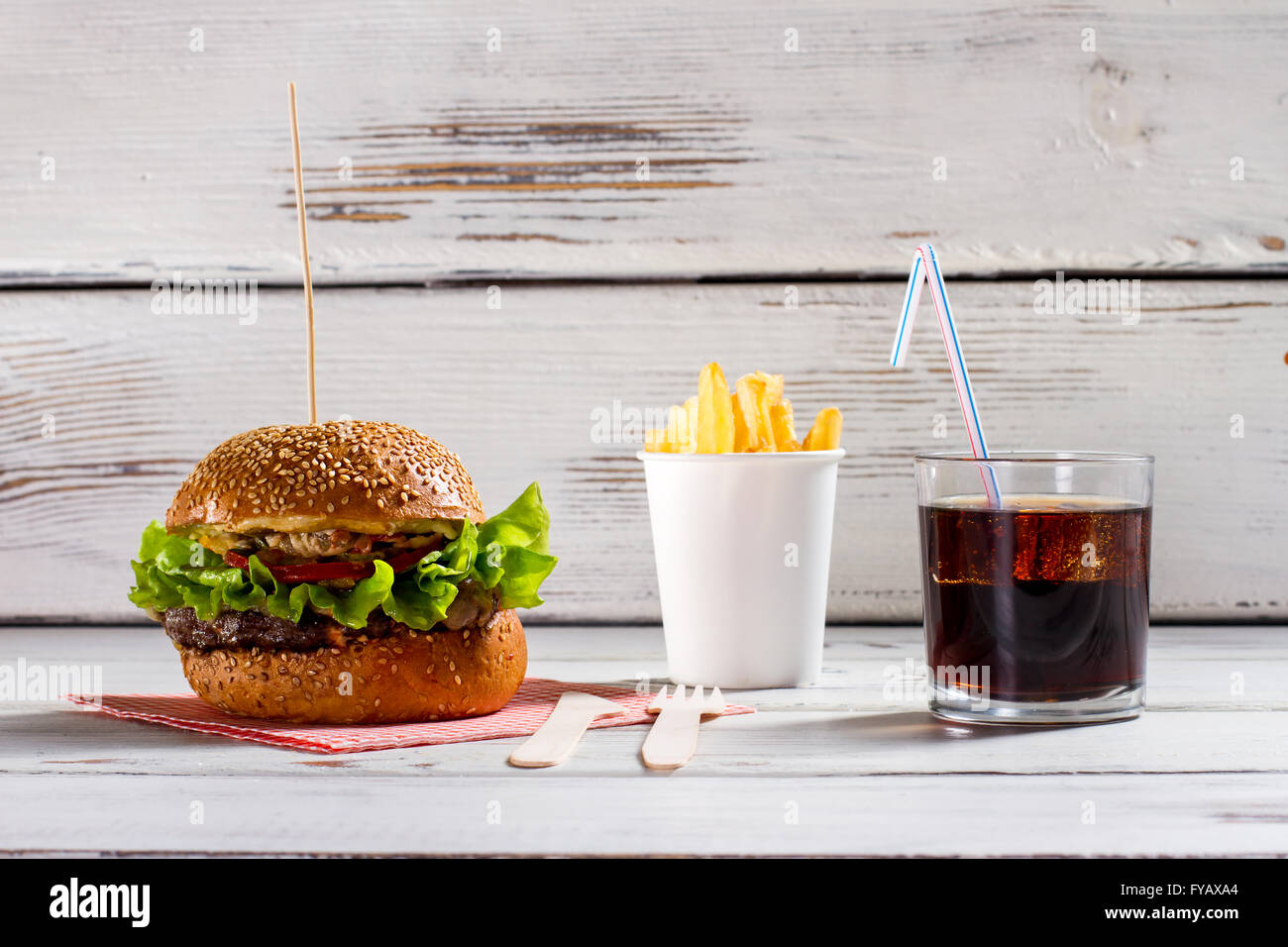 Burger on stick and fries. Stock Photo