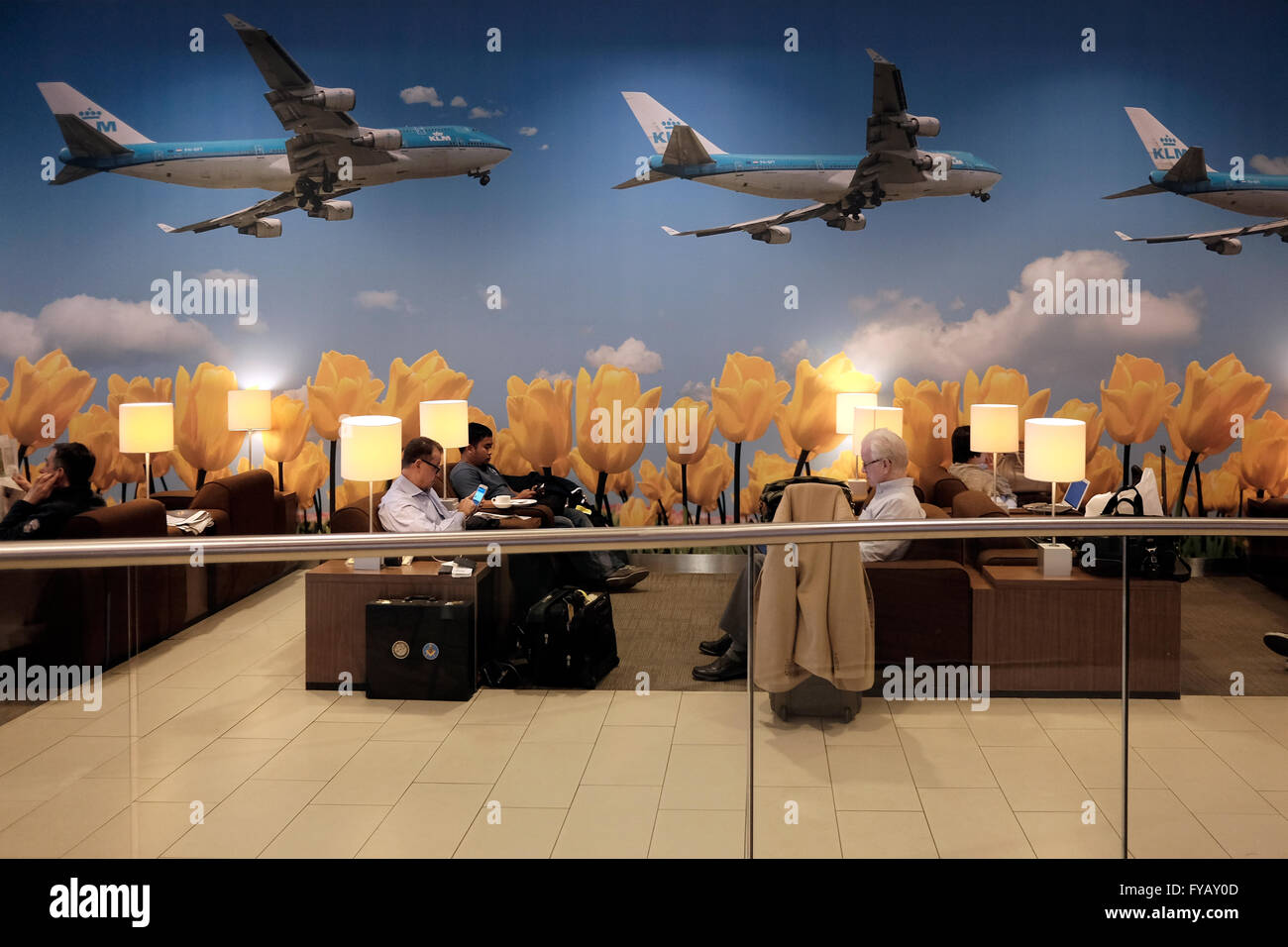 Passengers sitting at the KLM crown business lounge in Schiphol airport in Amsterdam Netherlands Stock Photo
