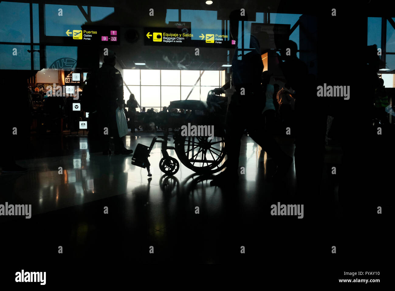 A silhouetted wheelchair at the departure hall in Tocumen International Airport in Panama city Panama Stock Photo
