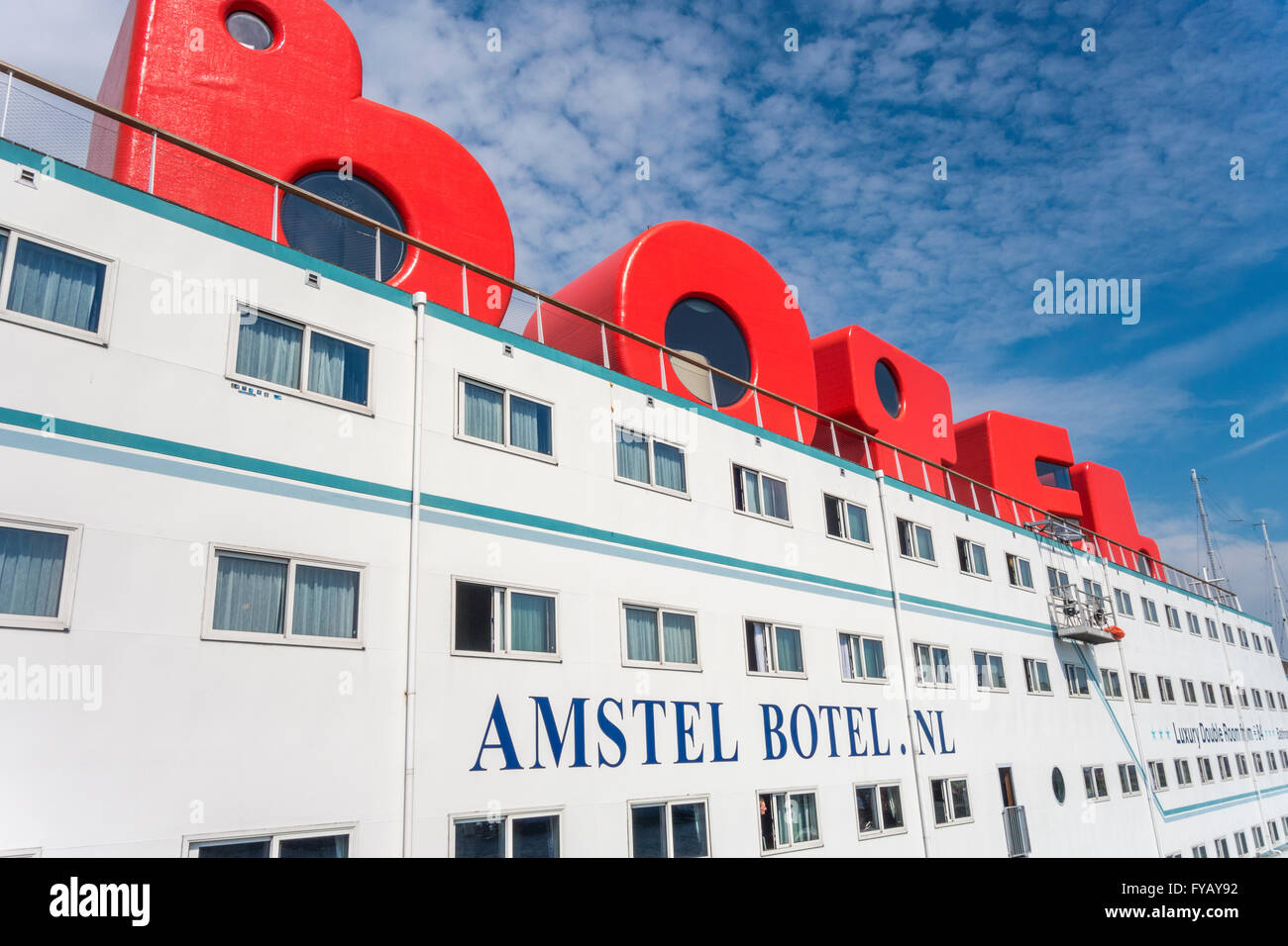 Amsterdam floating hotel Amstel Botel in Amsterdam IJ harbor with guest rooms in the BOTEL logo loft characters Stock Photo