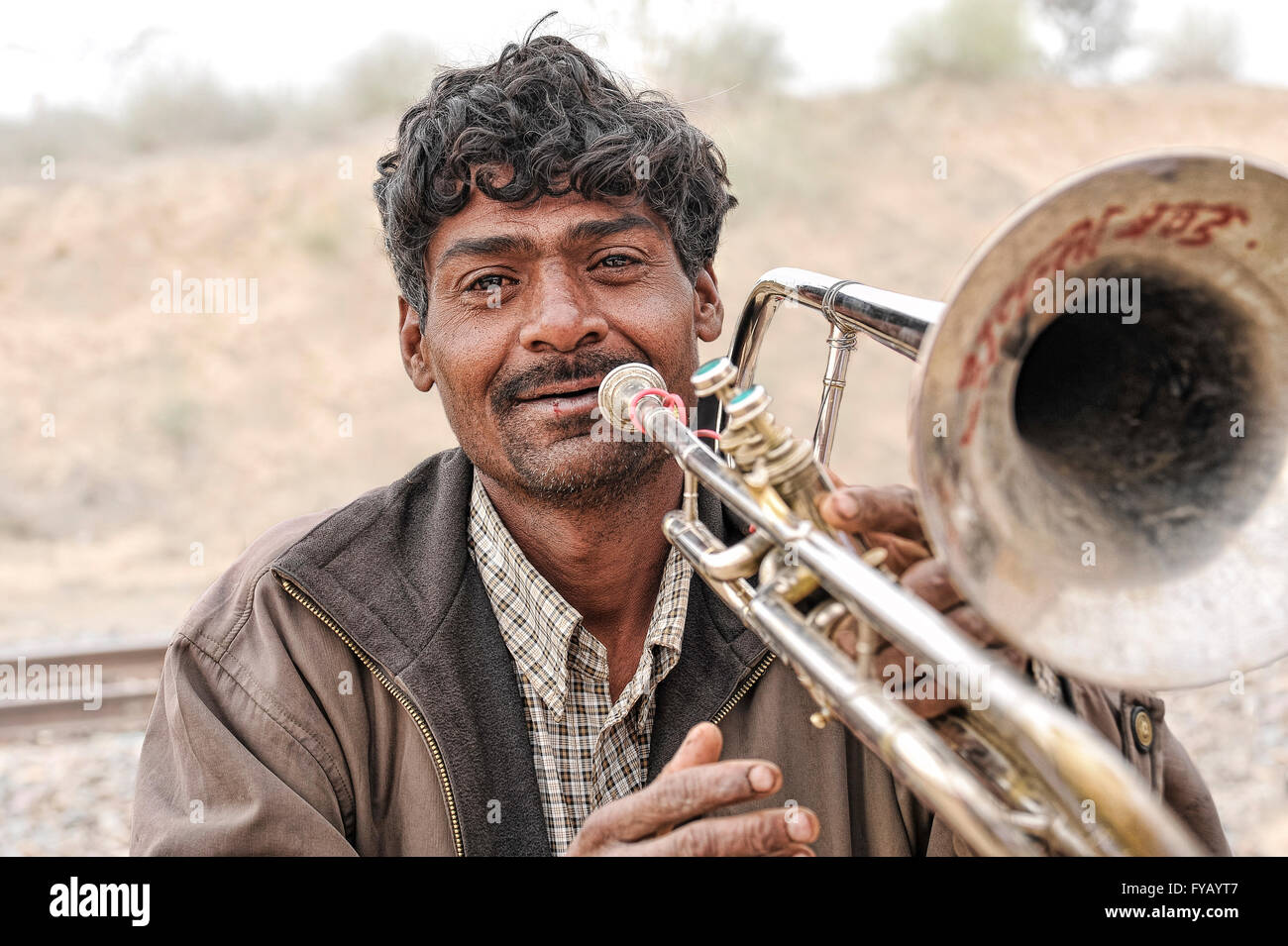 Indian man with trumpet Stock Photo
