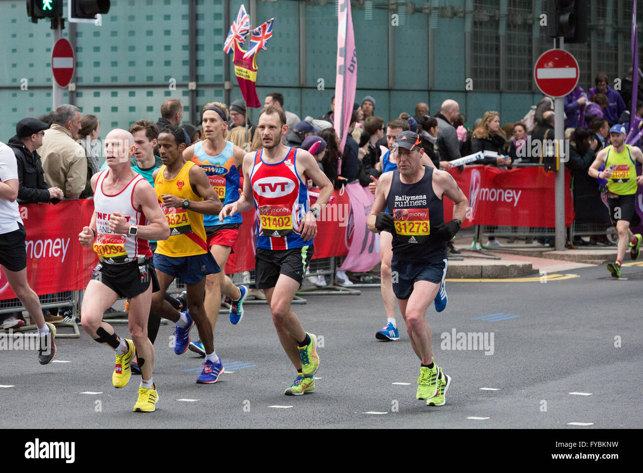 Competitors in the London Marathon running through the Canary Wharf ...