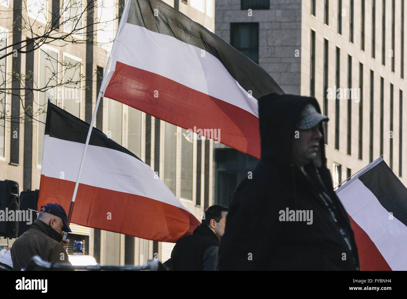 Berlin, Berlin, Germany. 25th Apr, 2016. Protesters waving flags with the national colors of the German Empire during the right-wing Baergida Rally in front of Berlin Central Station. Baergida, an Anti-Islamic, anti-immigration, far-right movement meet for the 69th time since their first rally in January 2015. © Jan Scheunert/ZUMA Wire/Alamy Live News Stock Photo