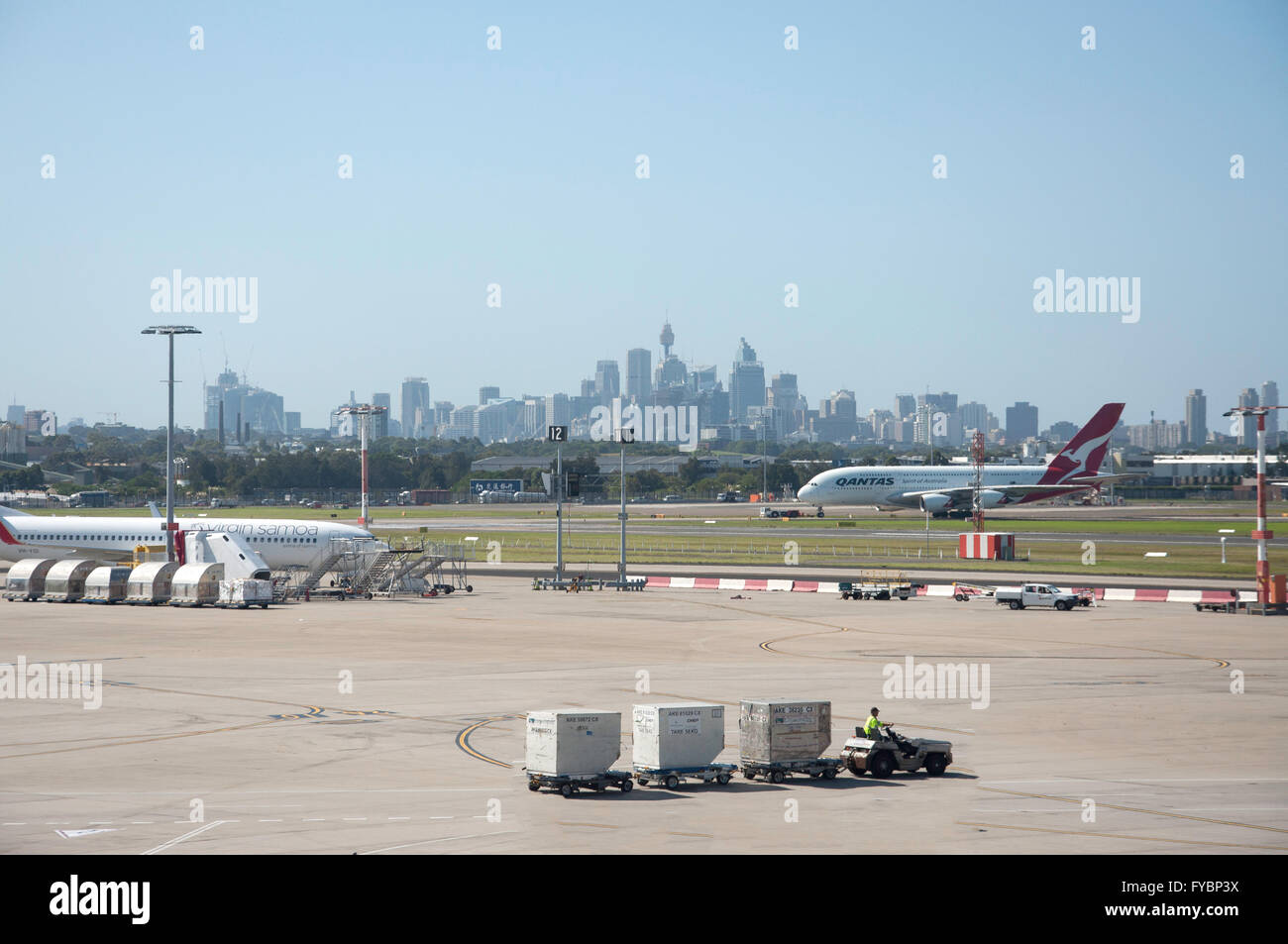 Qantas Airbus A380 with CBD in distance at Sydney Kingsford Smith Airport, Mascot, Sydney, New South Wales, Australia Stock Photo