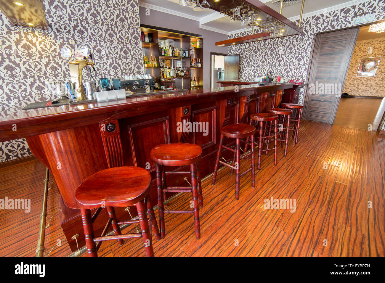 Bar interior with wooden chairs, counter an floor Stock Photo Alamy