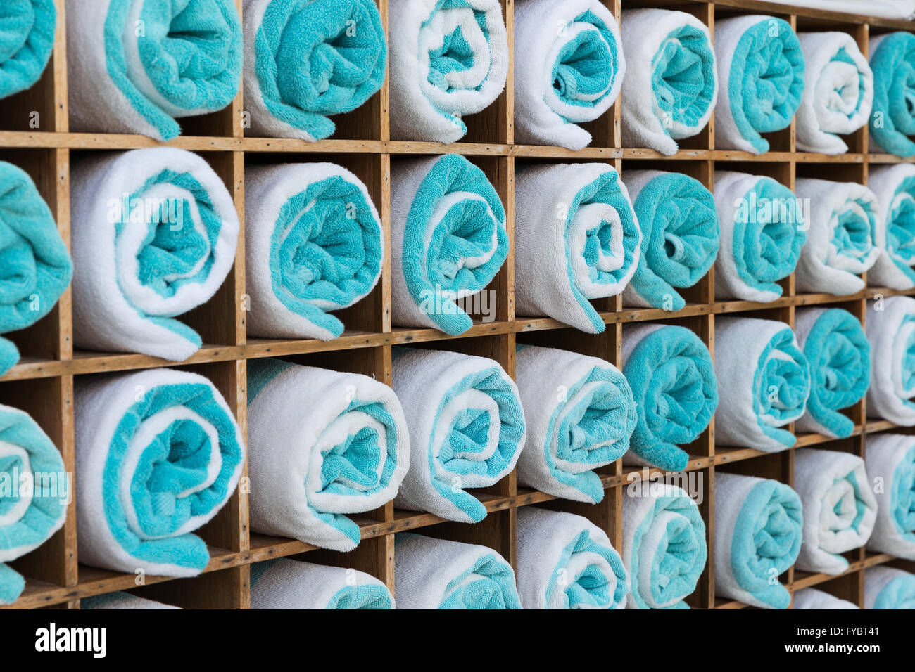 close up of shelf with rolled bath towels Stock Photo Alamy