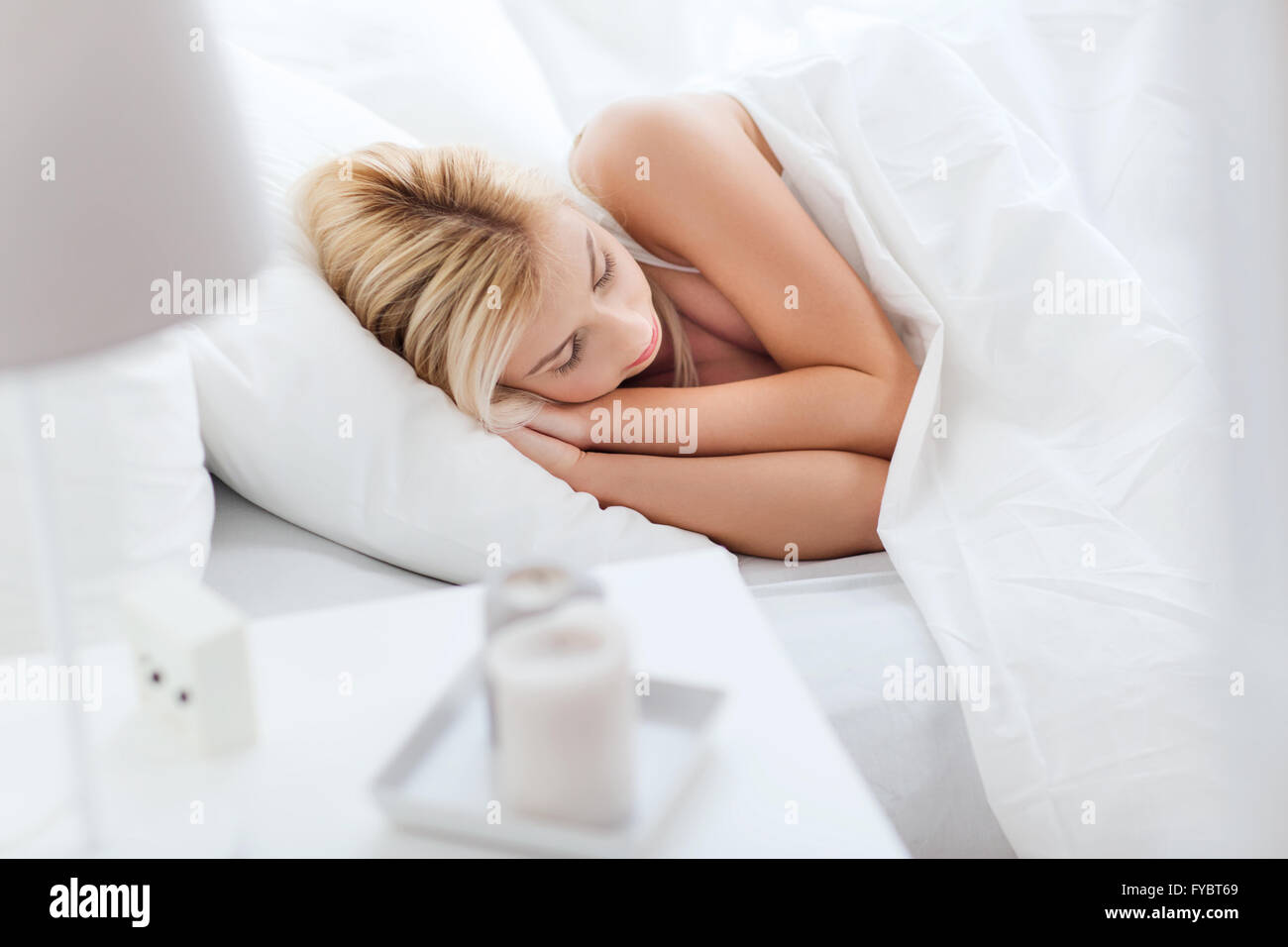 young woman sleeping in bed at home bedroom Stock Photo