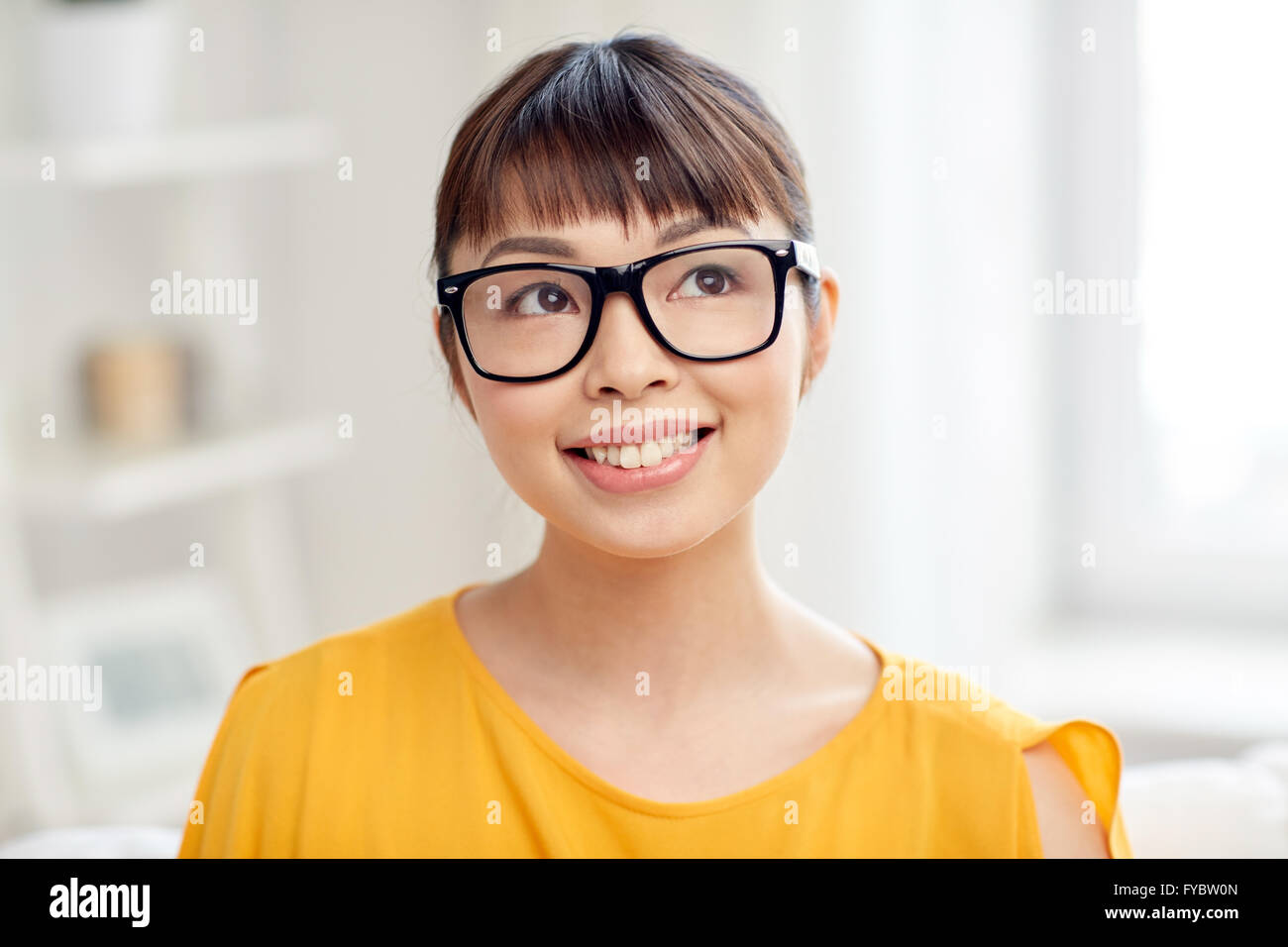 happy asian young woman in glasses at home Stock Photo - Alamy