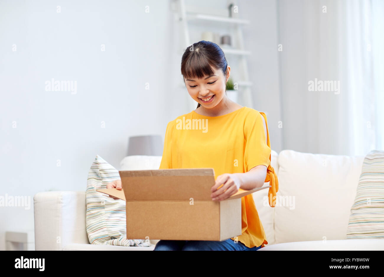 happy asian young woman with parcel box at home Stock Photo - Alamy
