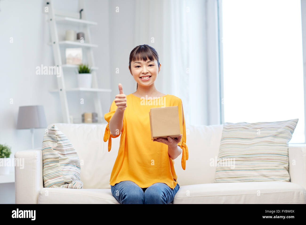 happy asian young woman with parcel box at home Stock Photo - Alamy