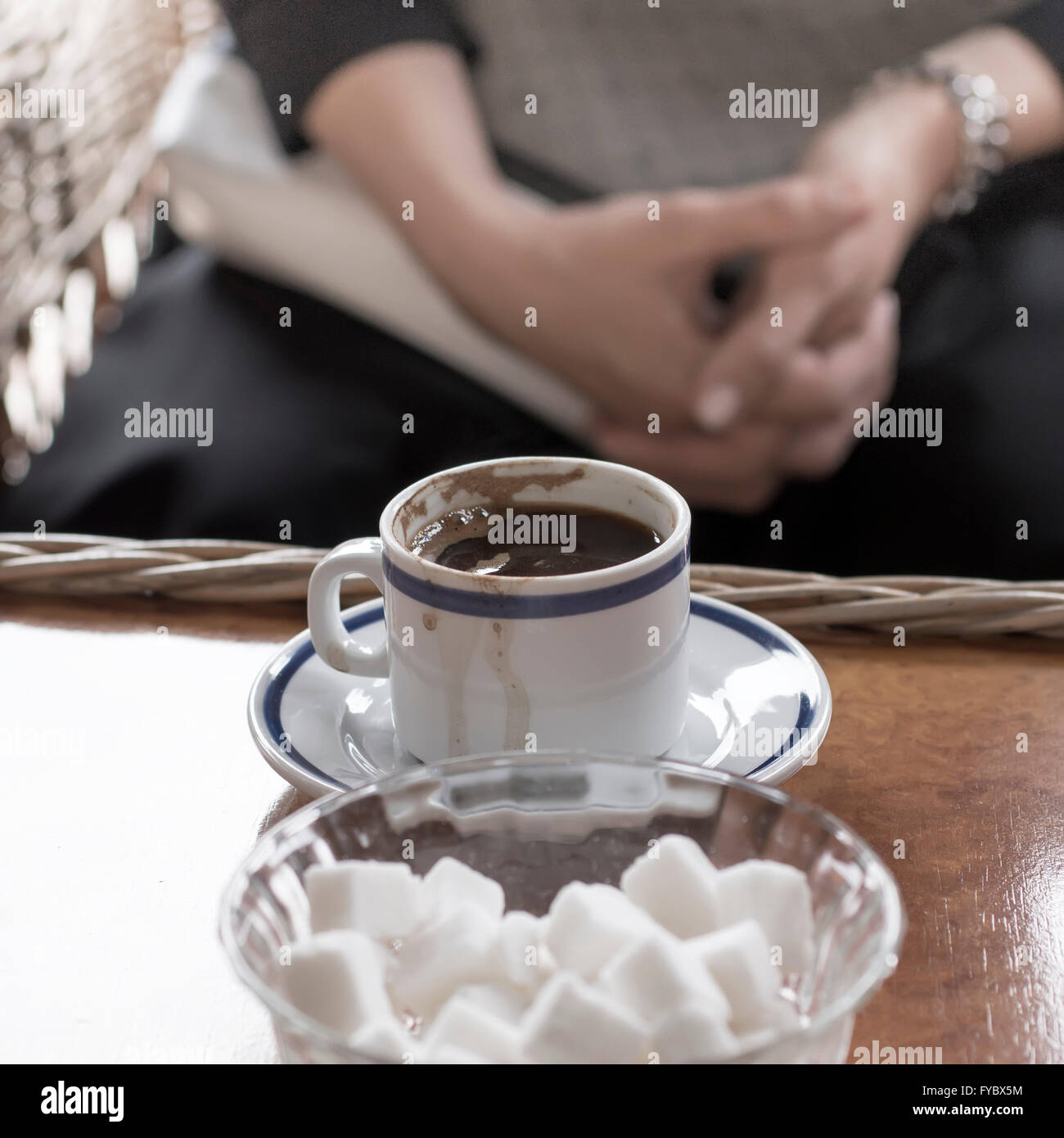 Hot coffee on old wood table with blur background, natural light Stock Photo