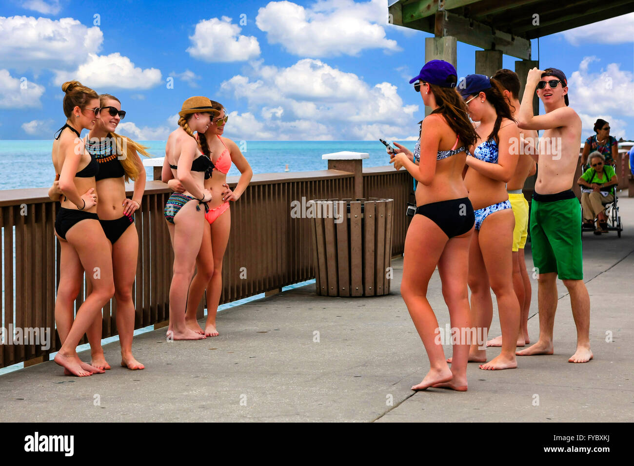 Spring break students enjoying the sunshine on Clearwater beach pier