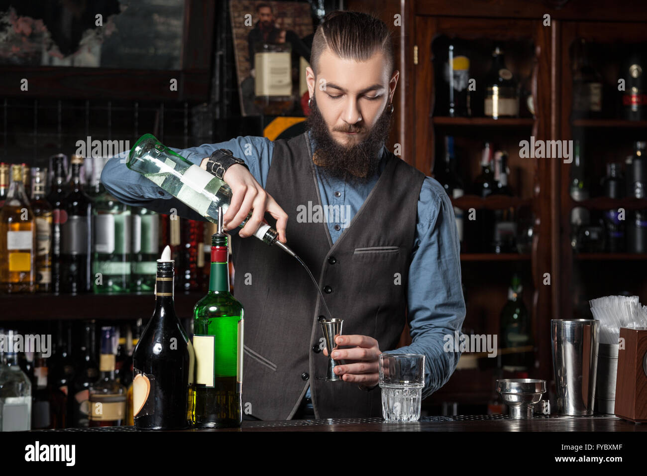 Expert barman is making cocktail. Stock Photo