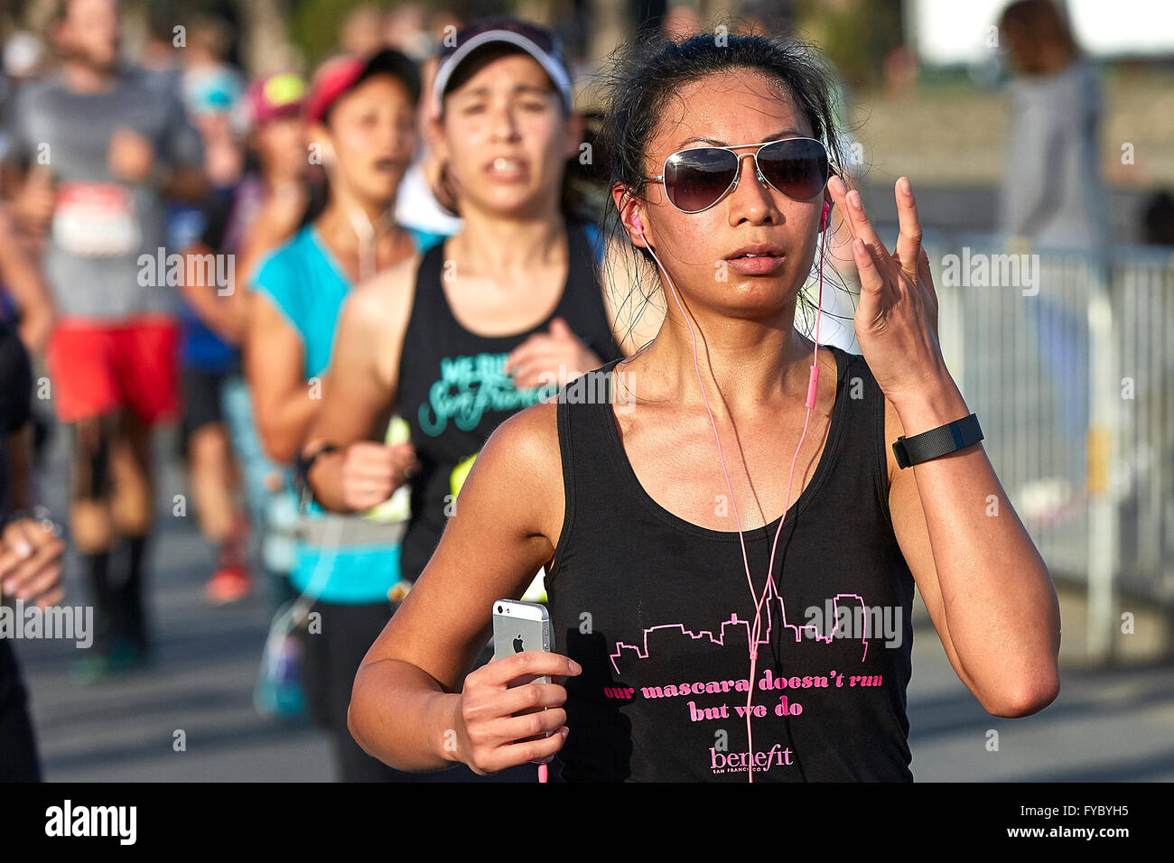 Committed Asian Female Athlete Running In The Nike Woman's Half Marathon,  San Francisco, 2015 Stock Photo - Alamy