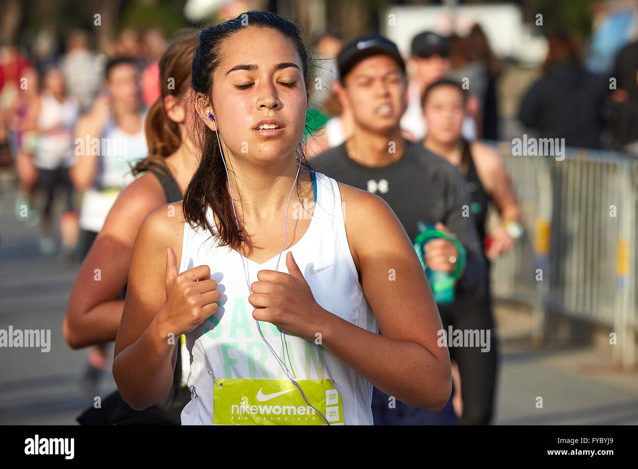 Female Athlete Approaching The Finish Line In The Nike Woman's Half Marathon, San Francisco, 2015. Stock Photo