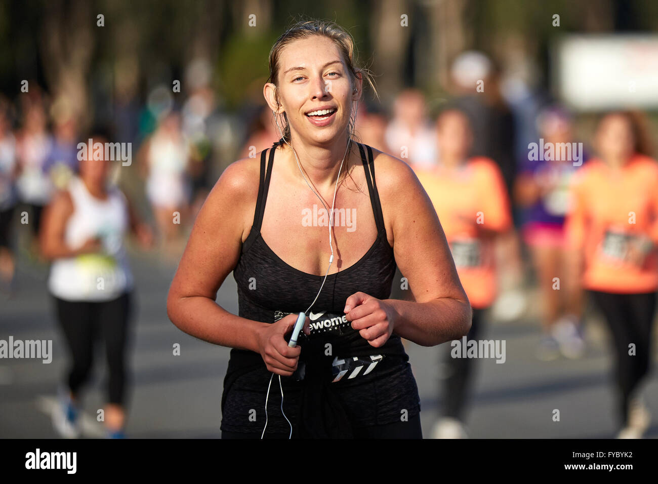 Relief Showing On A Female Athlete Running In The Nike Woman's Half Marathon, San Francisco, 2015. Stock Photo