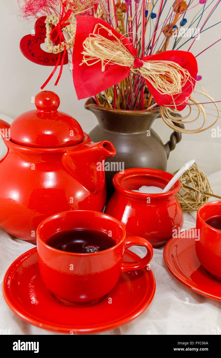 red porcelain tea set on white Stock Photo