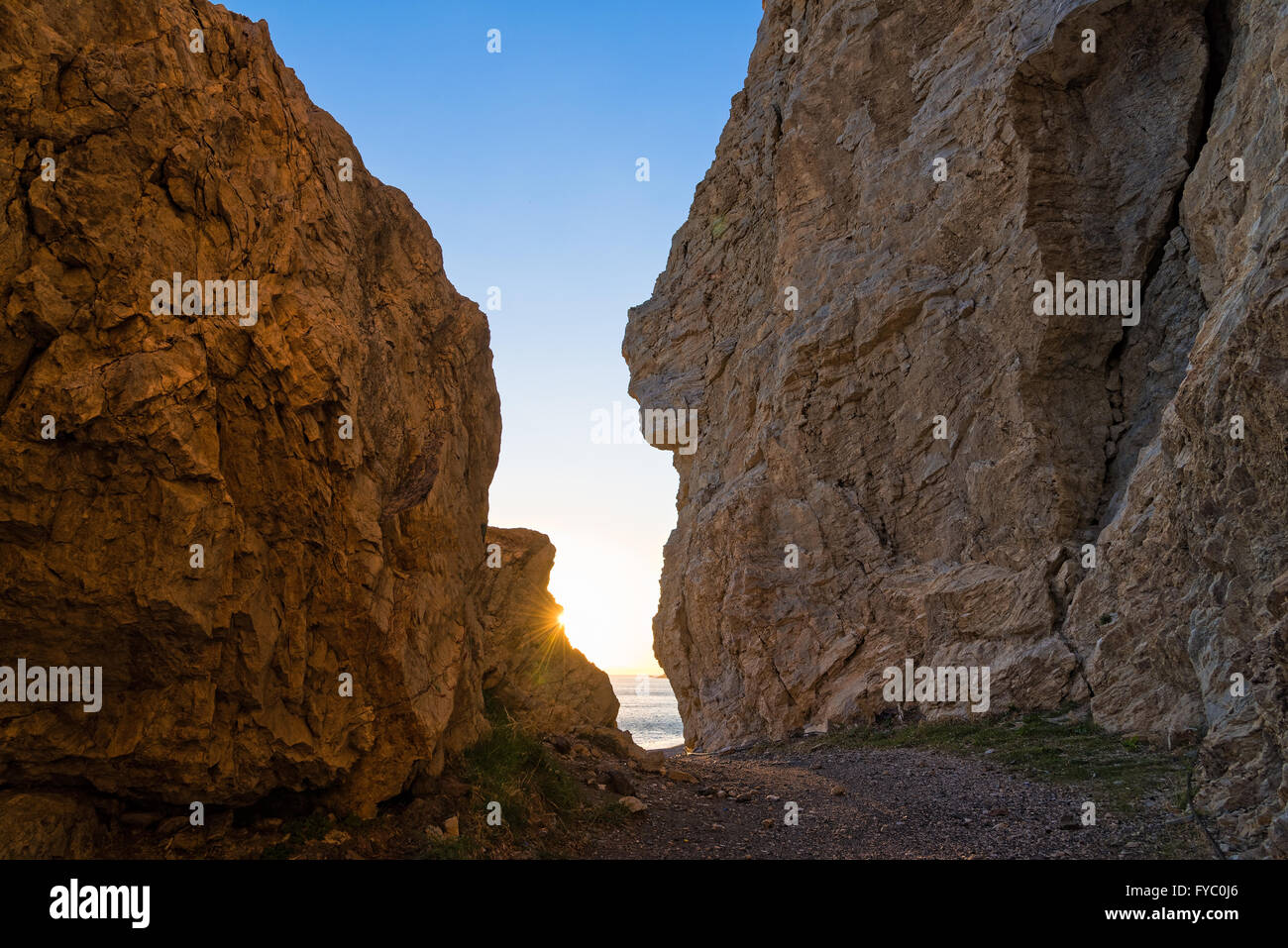 Rock formations at sunset on a beach of Kos island, Greece Stock Photo