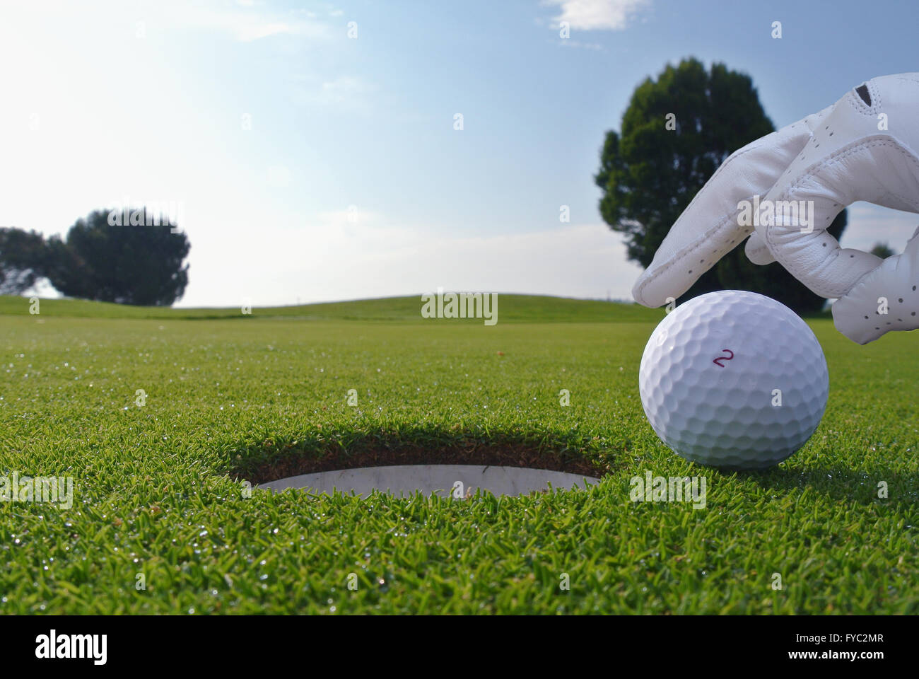 Man push ball in golf hires stock photography and images Alamy