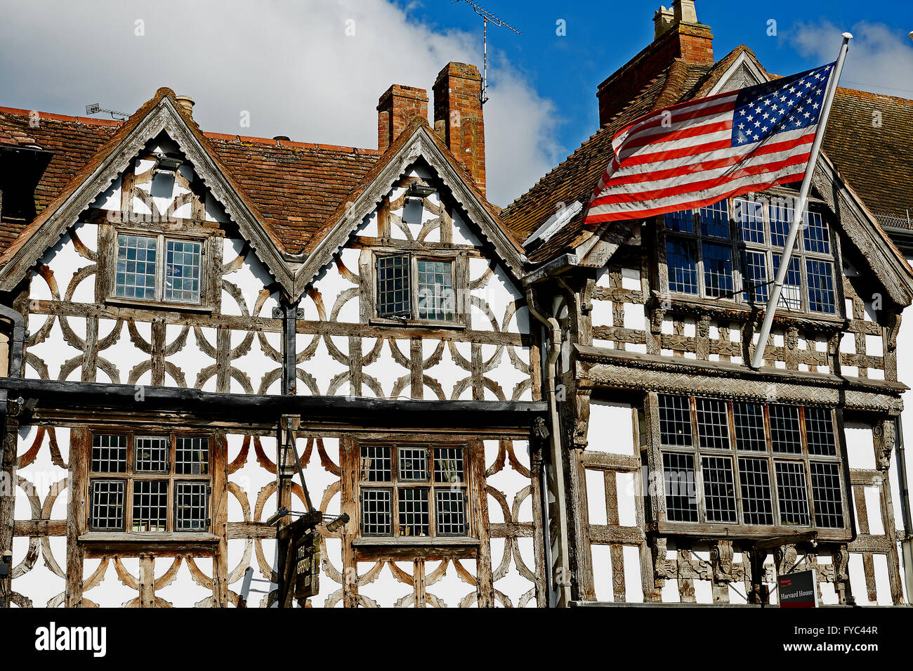 Harvard House in the centre of Stratford upon Avon with the United States Stars and Stripes flag flying Stock Photo