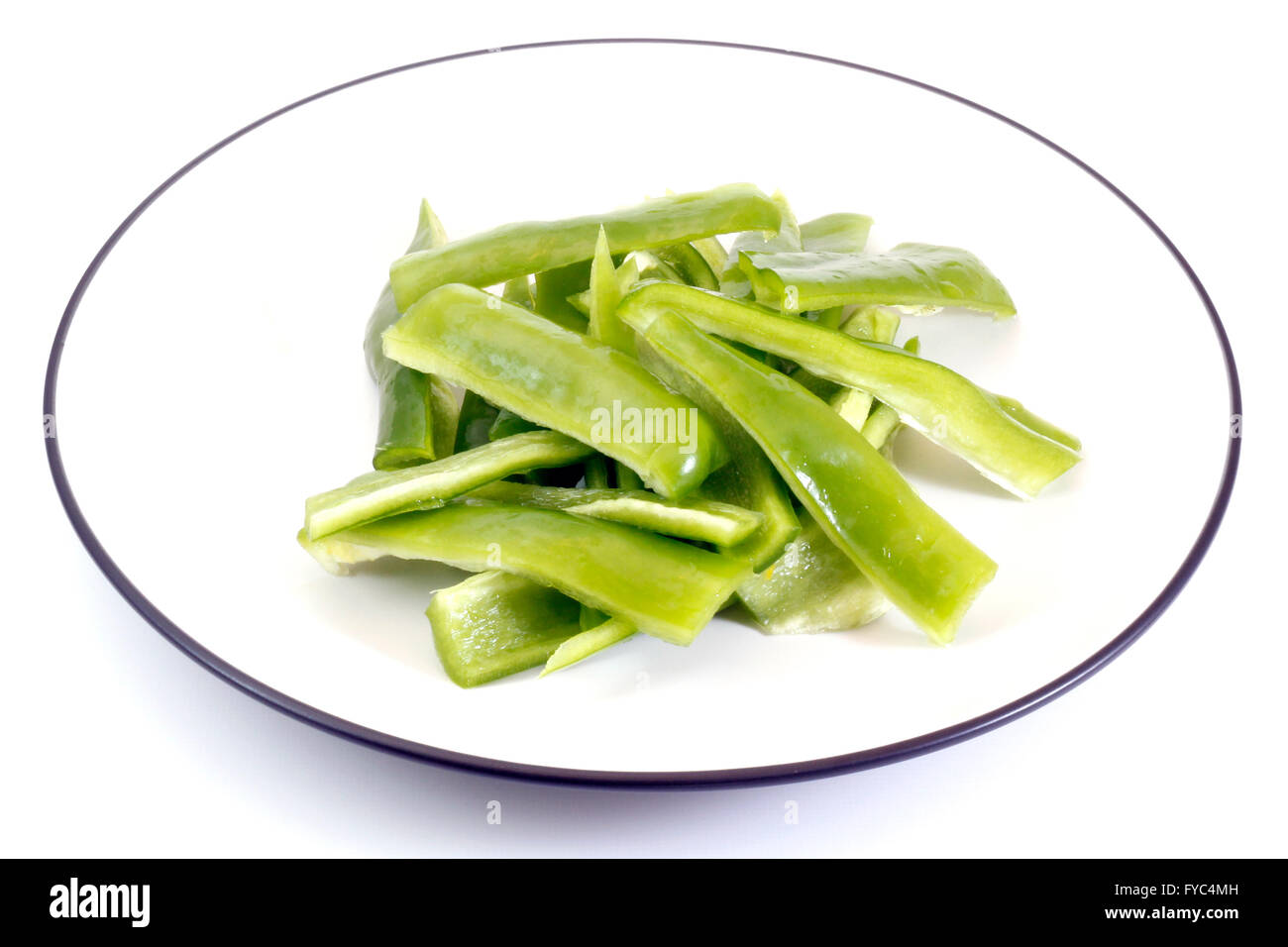 Cut Green Peppers in a plate Stock Photo
