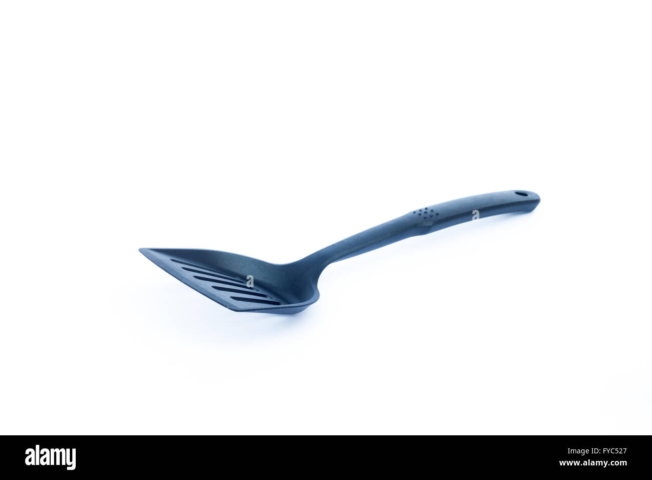 Black plastic kitchen spatula on white background, stock photo Stock