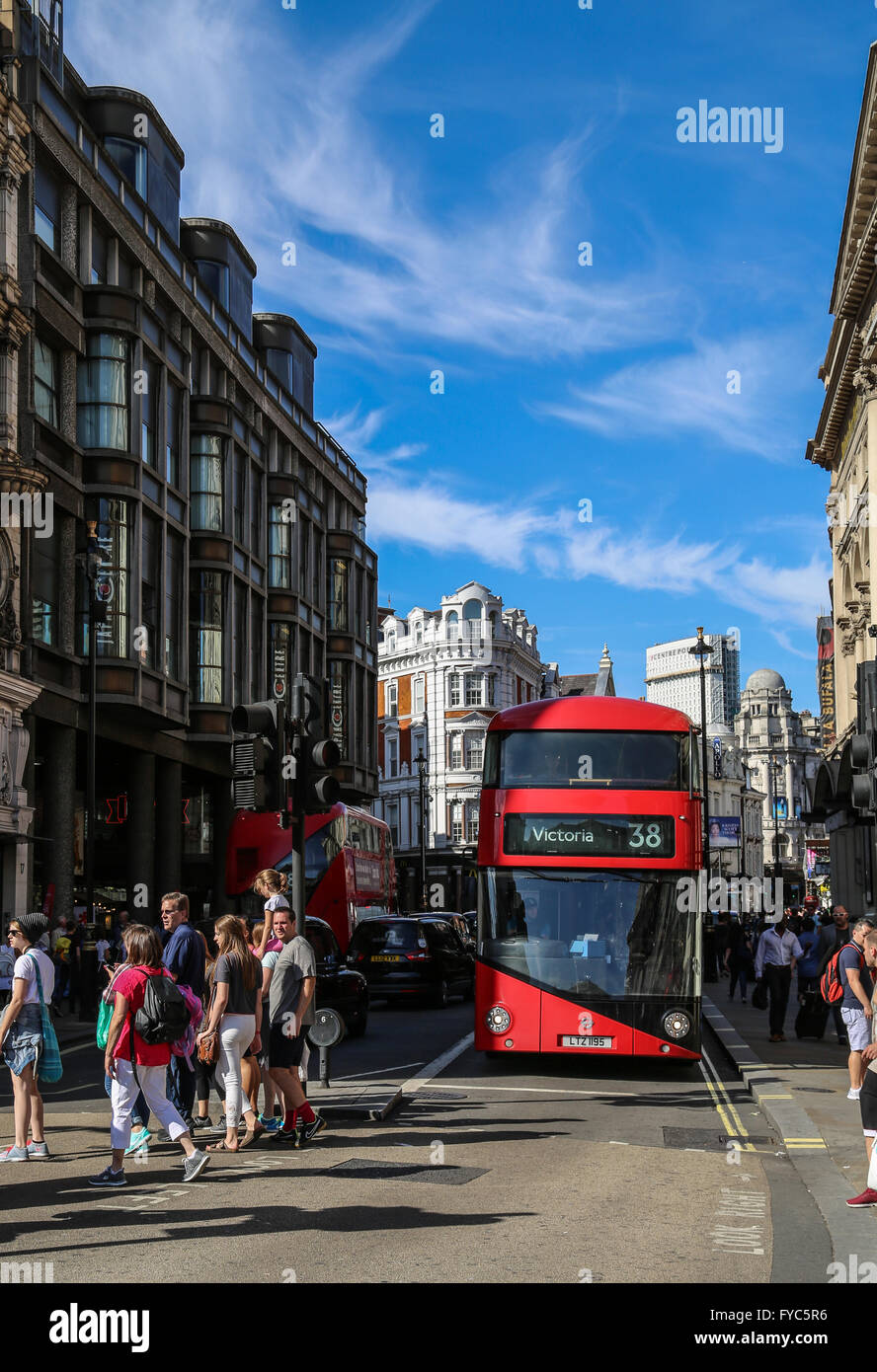 Red double decker London bus in the streets of Piccadilly Circus. Stock Photo