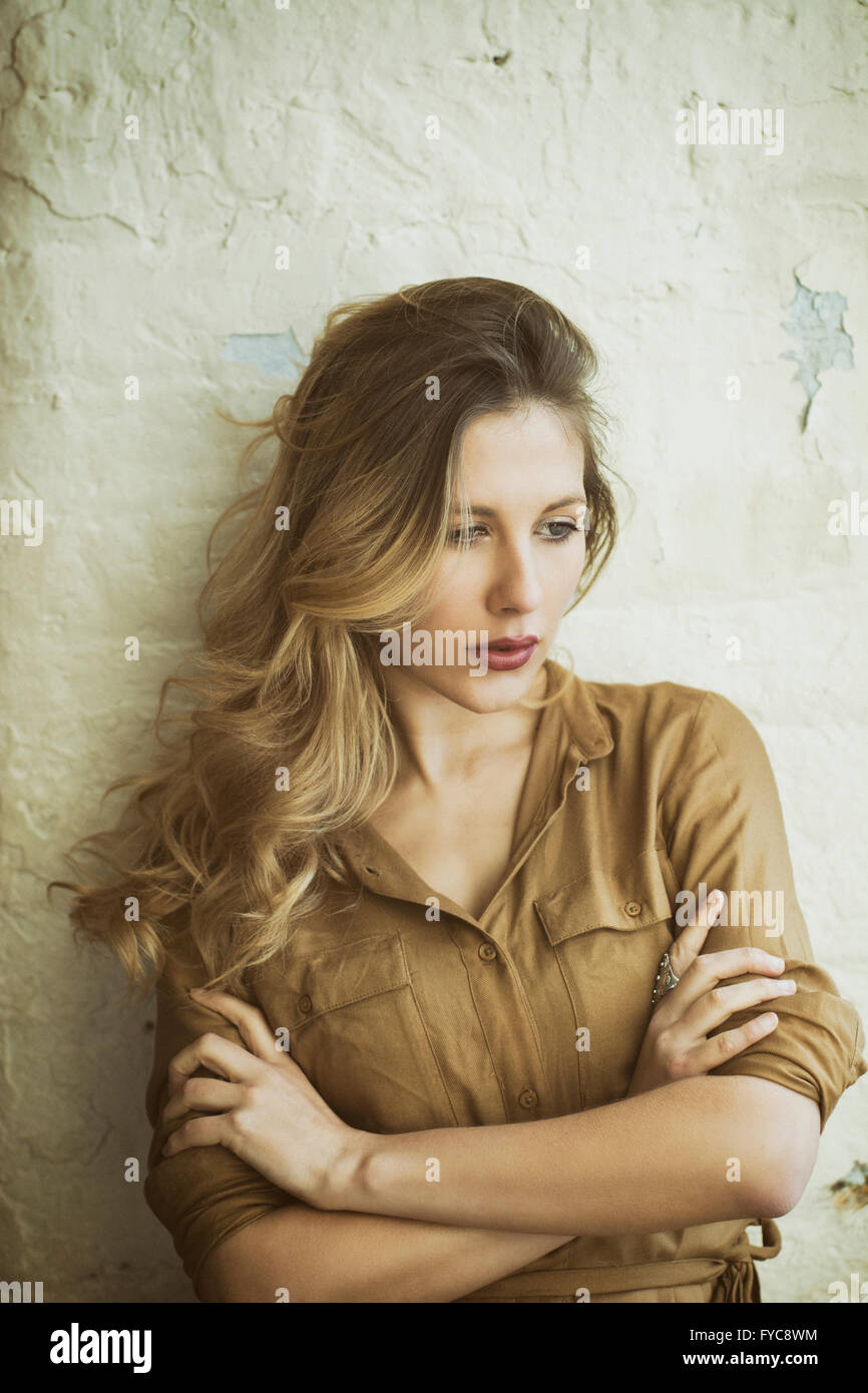 Sad woman arms folded looking away Stock Photo