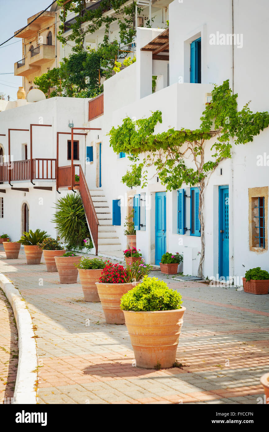 Image of a typical Greek street with white washed houses. Makrigialos, Crete. Stock Photo