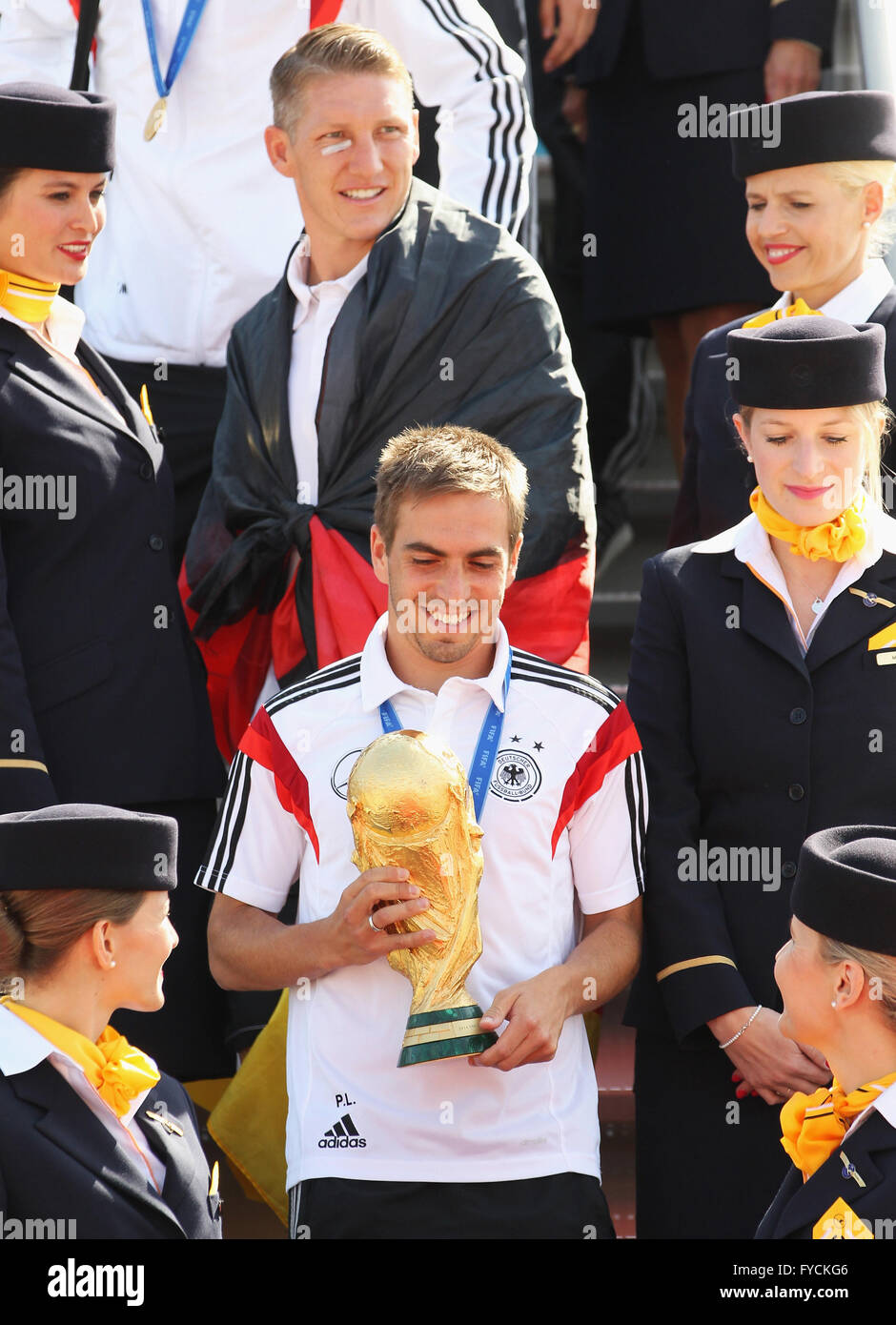 Philipp Lahm with the trophy and Bastian Schweinsteiger, arrival of the German national team after their victory at the FIFA Stock Photo