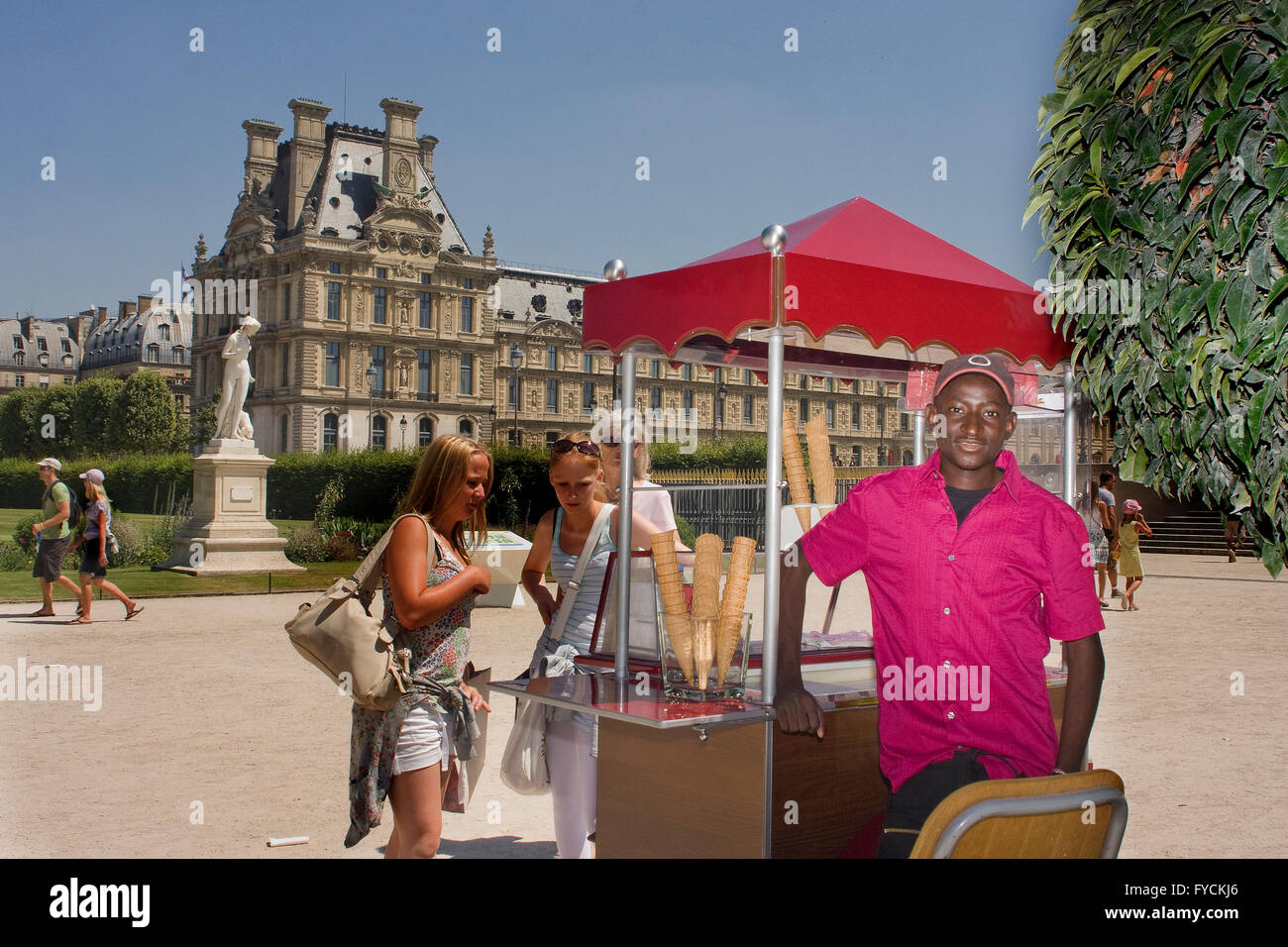 An ice cream seller poses for a photos taken in Paris Stock Photo