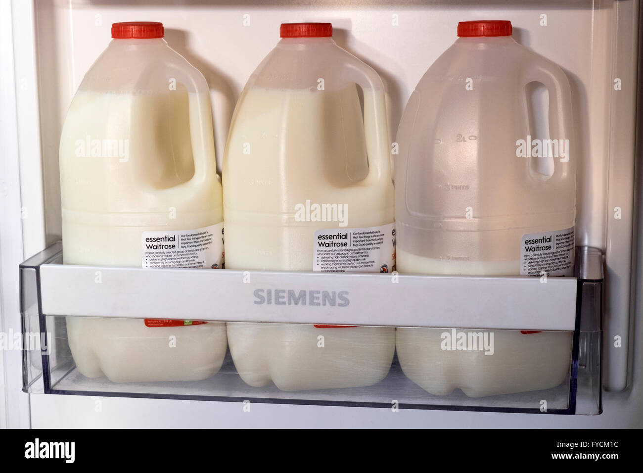 Essential Waitrose skimmed milk in fridge Stock Photo Alamy