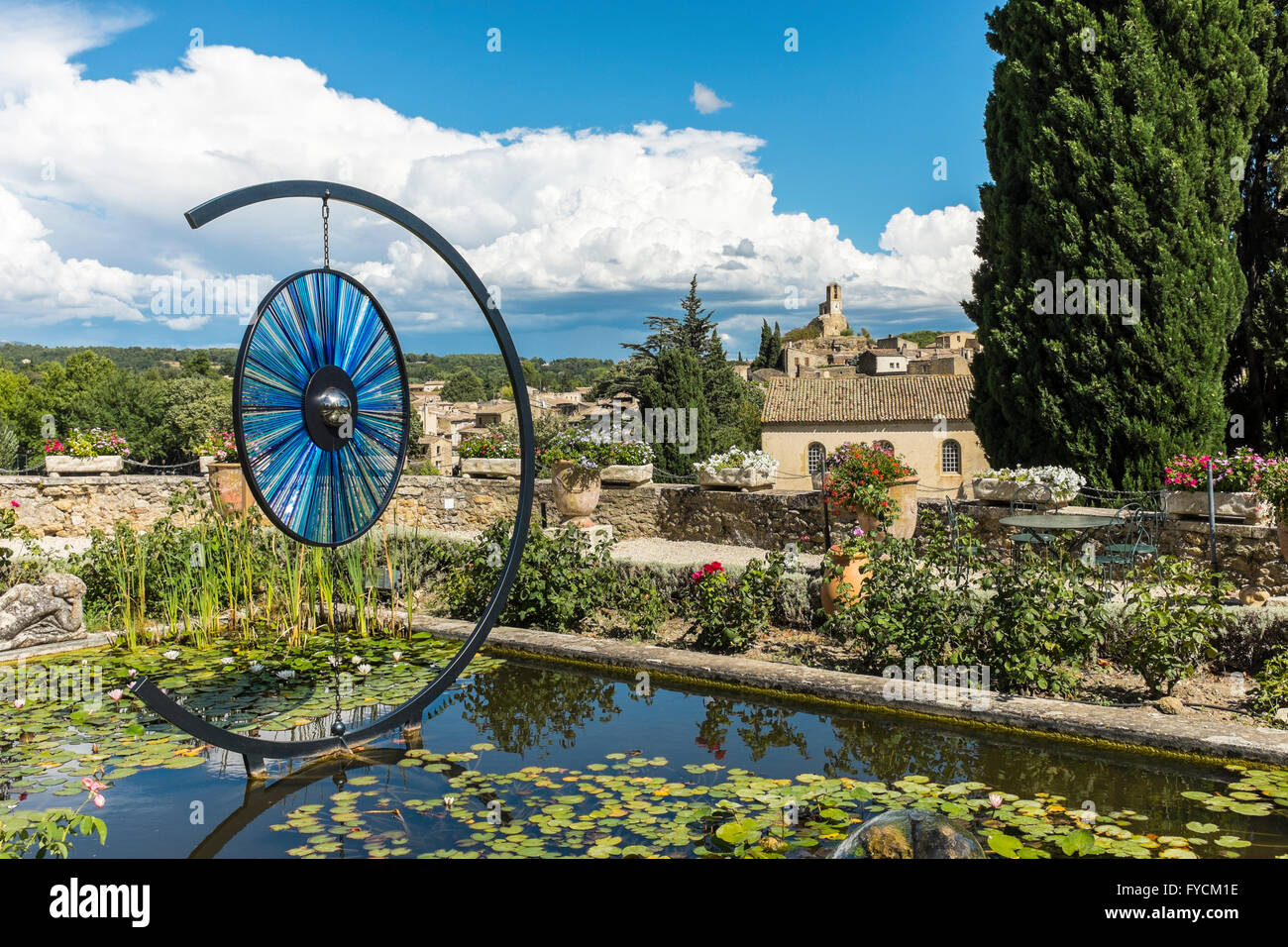 Pond and sculpture on the ground of Lourmarin Castle, Vaucluse, Provence-Alpes-Côte d'Azur, France Stock Photo