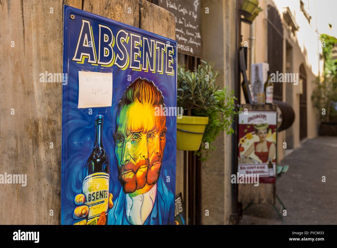 Village shop with a poster of Van Gogh holding a bottle of Absinth, Lourmarin, Vaucluse, Provence-Alpes-Côte d'Azur, France Stock Photo