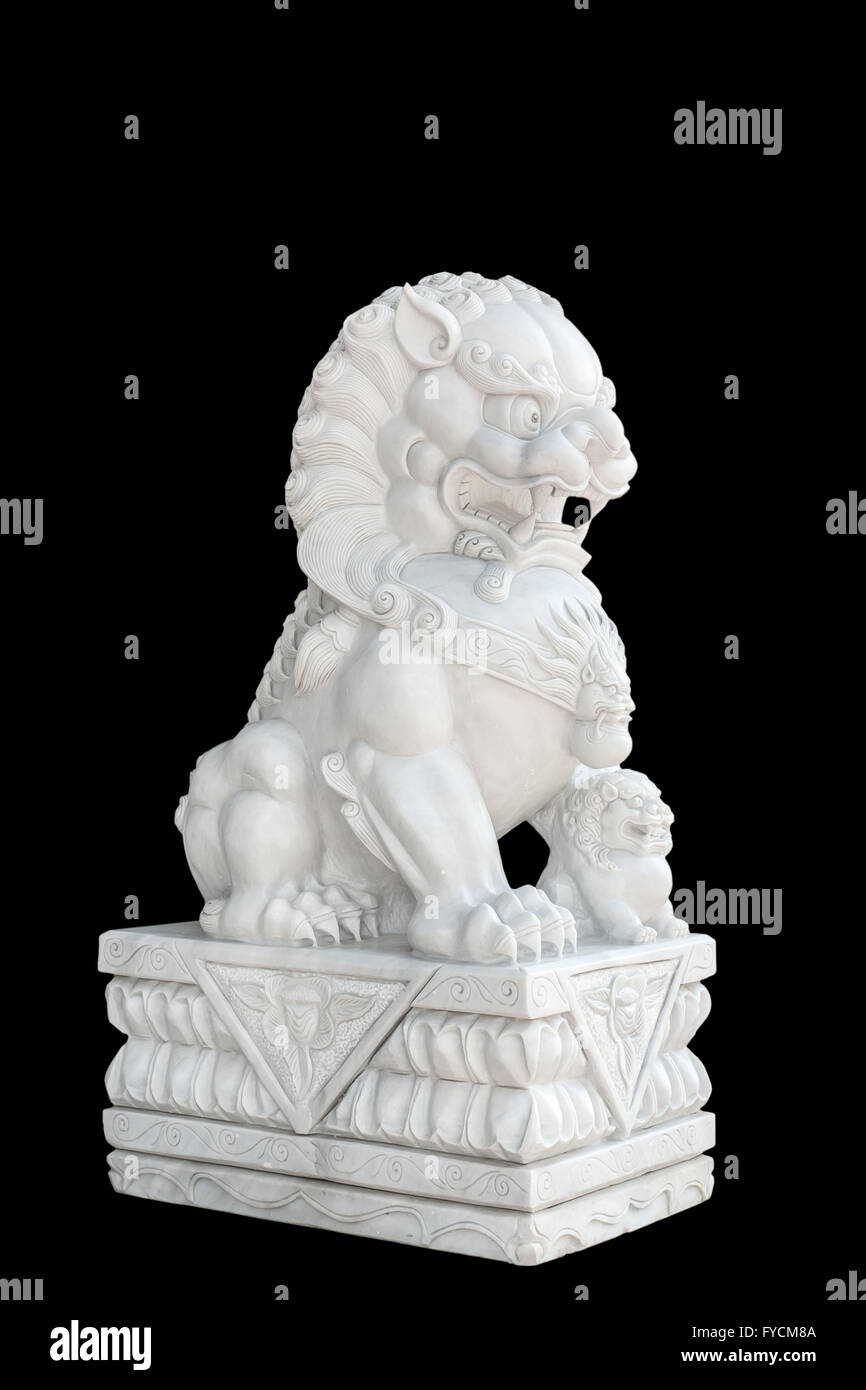 Chinese Imperial Lion statue isolated on black background. Stock Photo