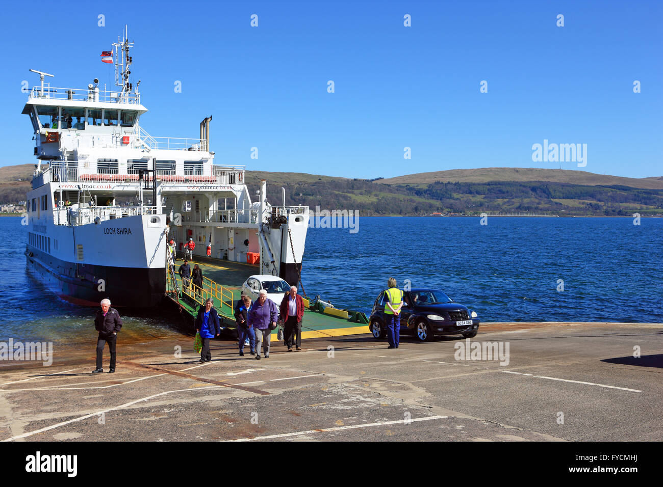Passengers and cars disembarking on the Isle of Cumbrae from the Calmac ferry, Loch Shira, which runs between Largs and Cumbrae Stock Photo