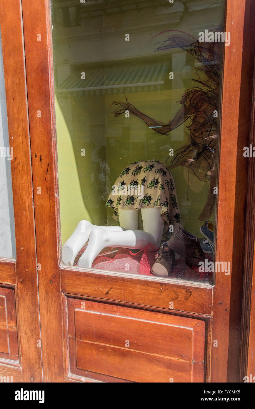 Female mannequin bent over from behind in a shop window display.  Bizarre and wonderful. Old Havana, Cuba Stock Photo