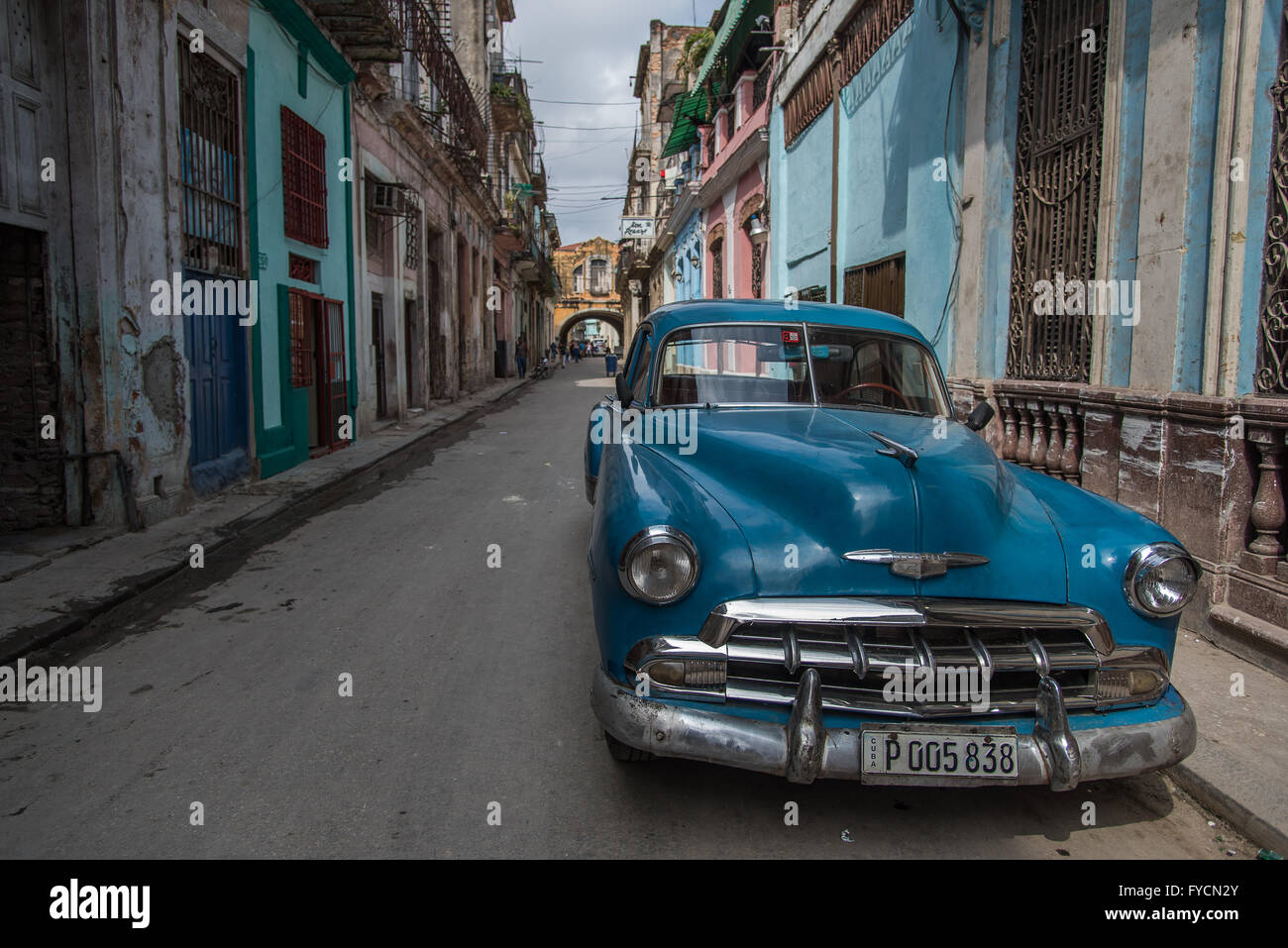Vibrant bright blue beautifully weathered classic American car available for a city tour around La Habana, Havana, Cuba. Stock Photo