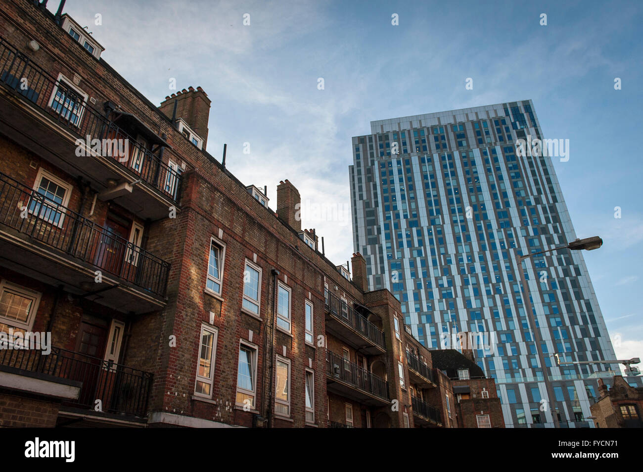 Deeply contrasting buildings in the East End of London where new skyscrapers go up next to the old. Stock Photo