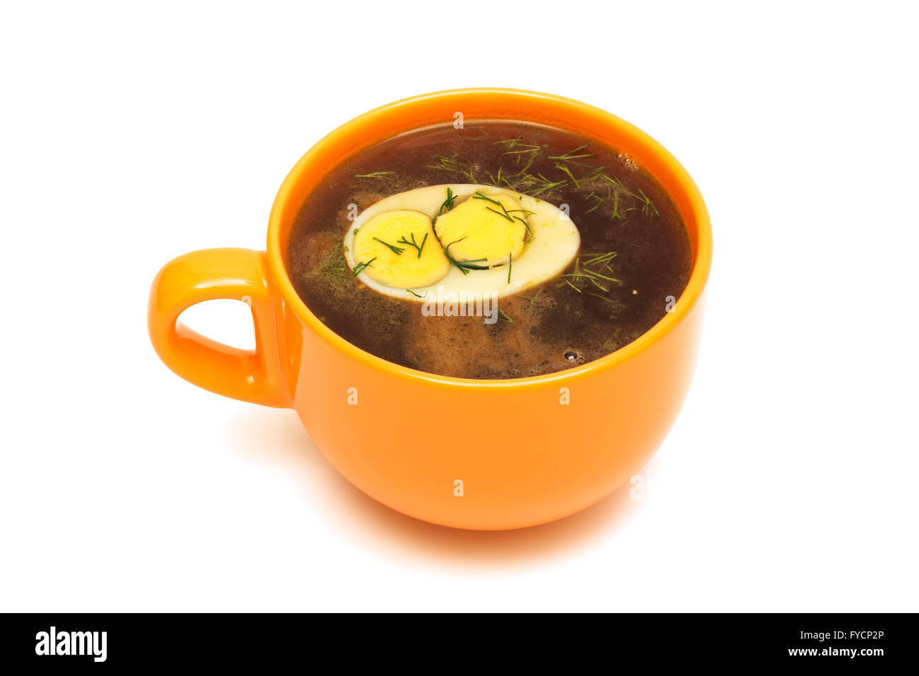 Beef broth with egg on white background Stock Photo Alamy