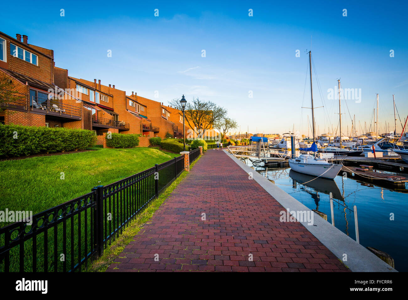 Houses and boats along the waterfront promenade, in Canton, Baltimore