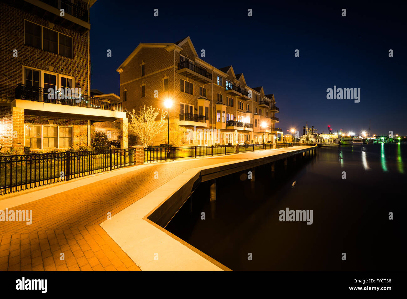 Waterfront apartment building at night, in Canton, Baltimore, Maryland. Stock Photo