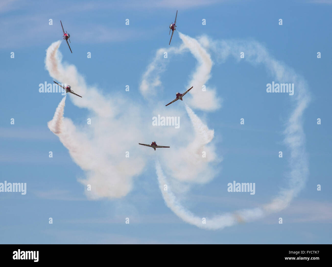 The Canadian Snowbirds aerobatic team perform complicated maneuvers in the sky over Springbank Airport near Calgary, Alberta. Stock Photo