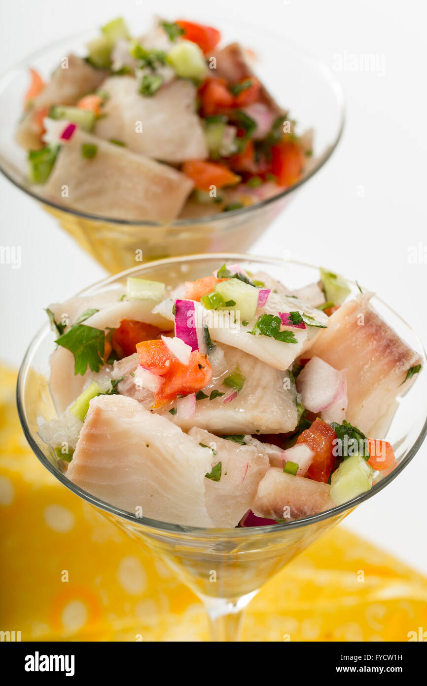 Ceviche in martini glass. Salsa and fish cubes piled high for a festive snack. Stock Photo