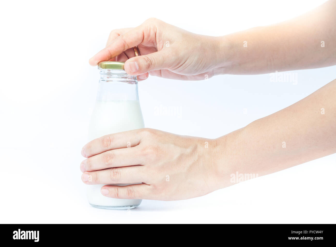 Woman hand open traditional glass milk bottle, stock photo Stock Photo