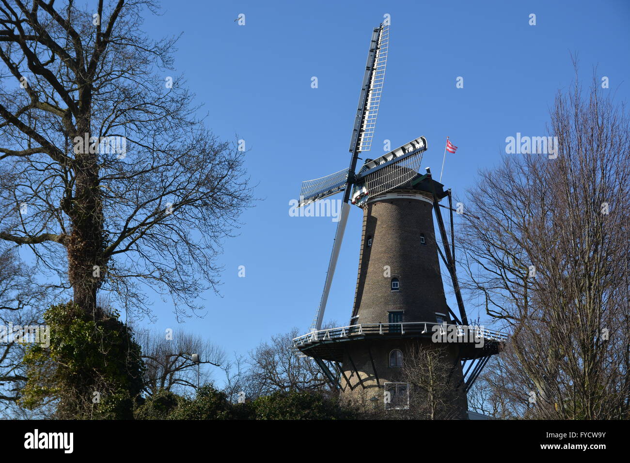 Alkmaar, Netherlands - March 27, 2016: Windmill with blue sky in Alkmaar Stock Photo