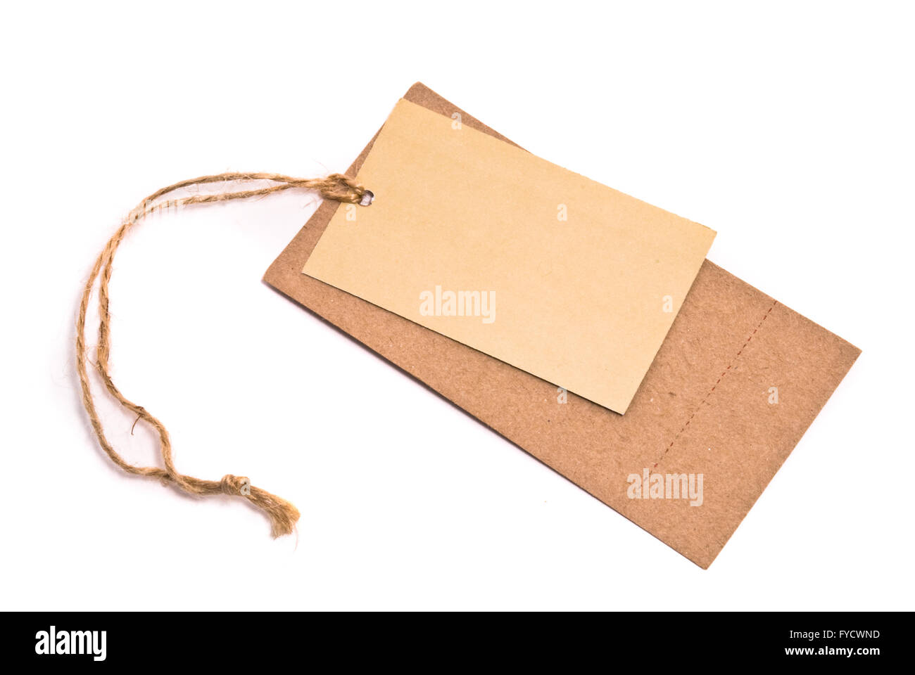 Blank tag tied with brown string. Stock Photo