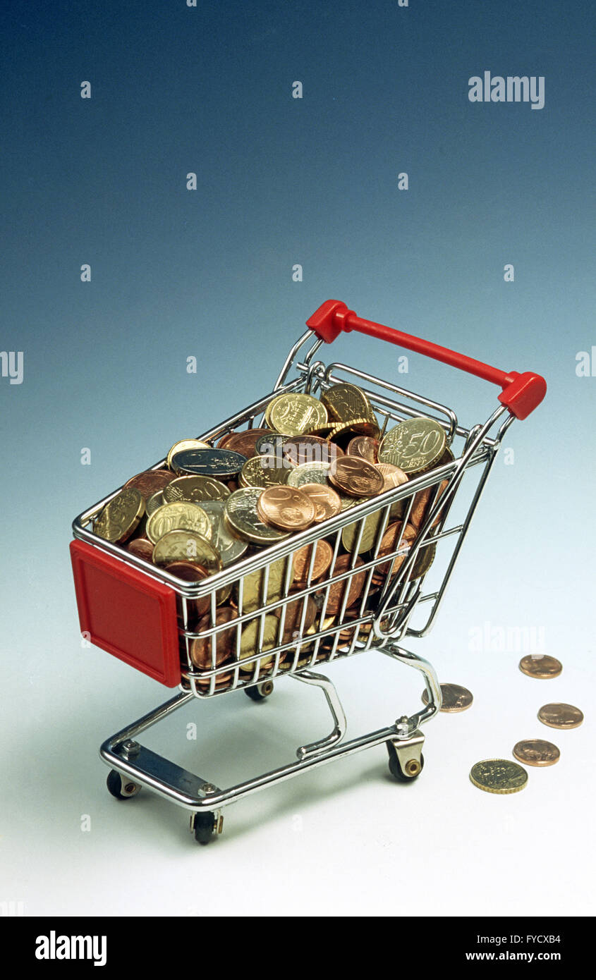 Cart filled with coins Stock Photo