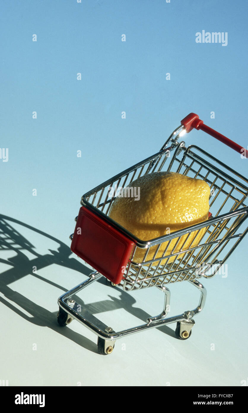 Shopping-cart with one lemon Stock Photo